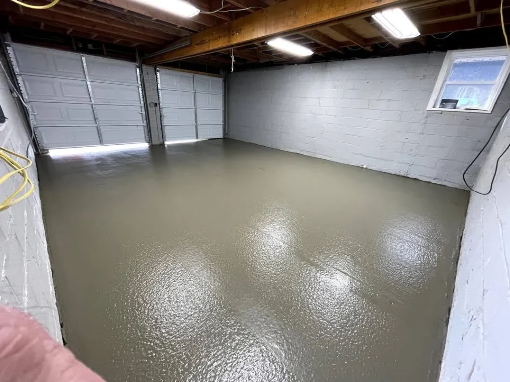 Garage floor concrete requirements in Calgary showing long-term wear from vehicle loads and freeze-thaw exposure