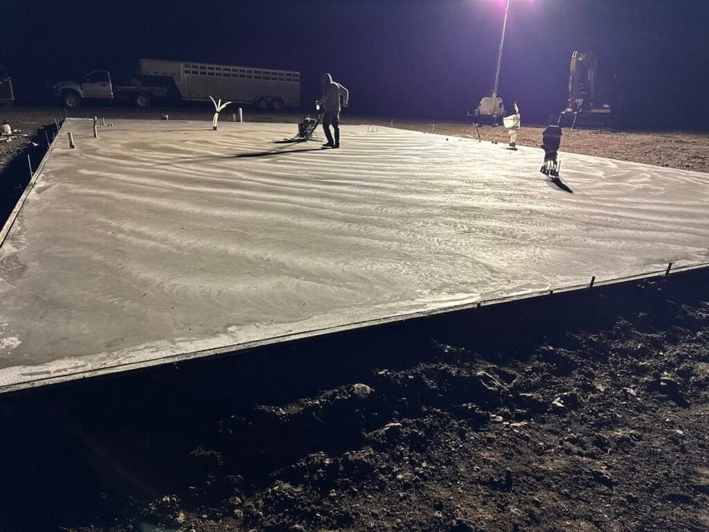 Concrete slab pour at night with proper lighting, crew coordination, and site preparation