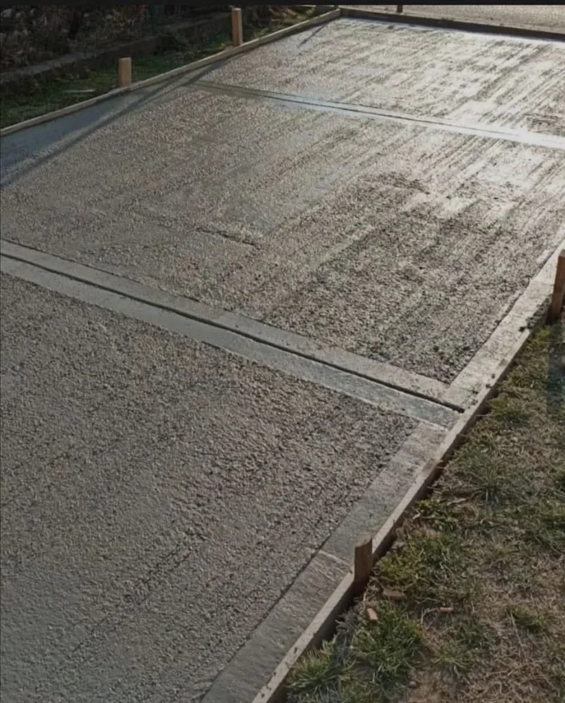 Exposed aggregate concrete driveway installation showing natural stone texture and slip-resistant surface
