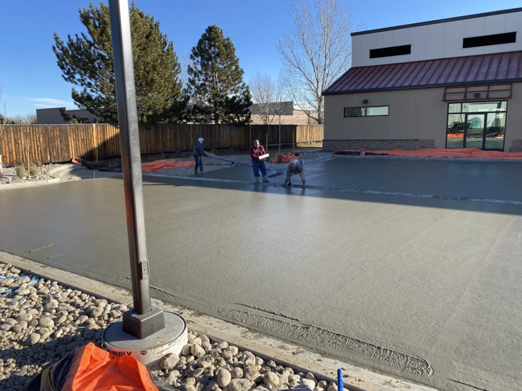 Concrete patio installation in Calgary showing finishing and leveling for a durable outdoor slab