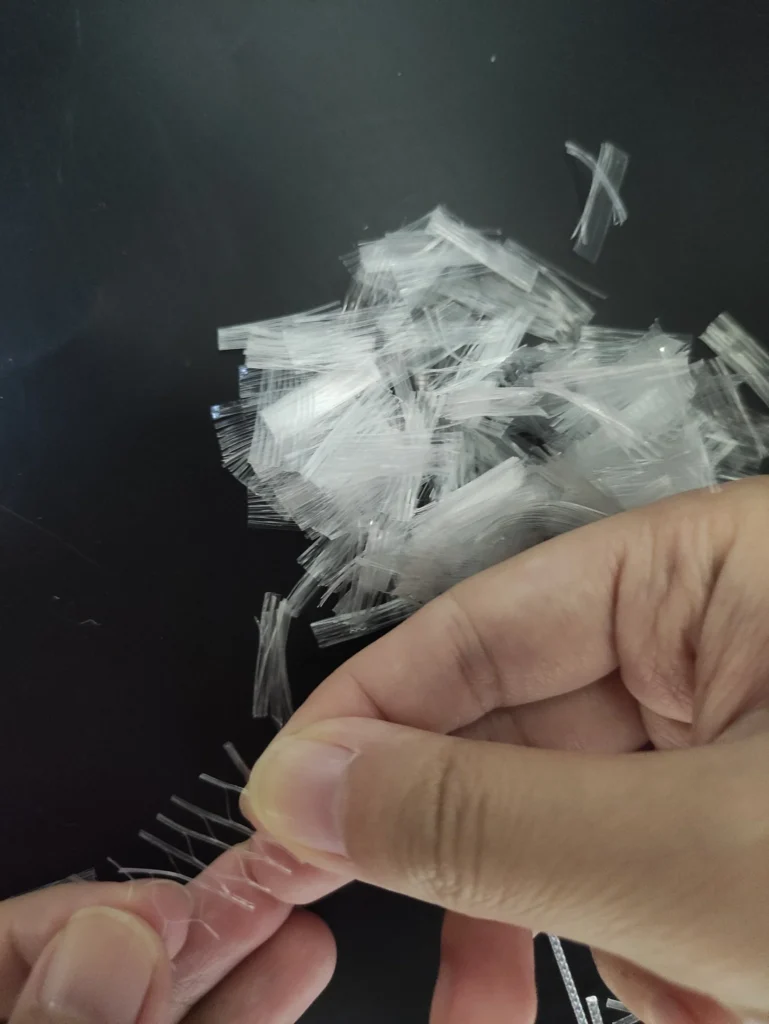 Fiber mesh in concrete used to reduce shrinkage cracking in residential slabs and driveways