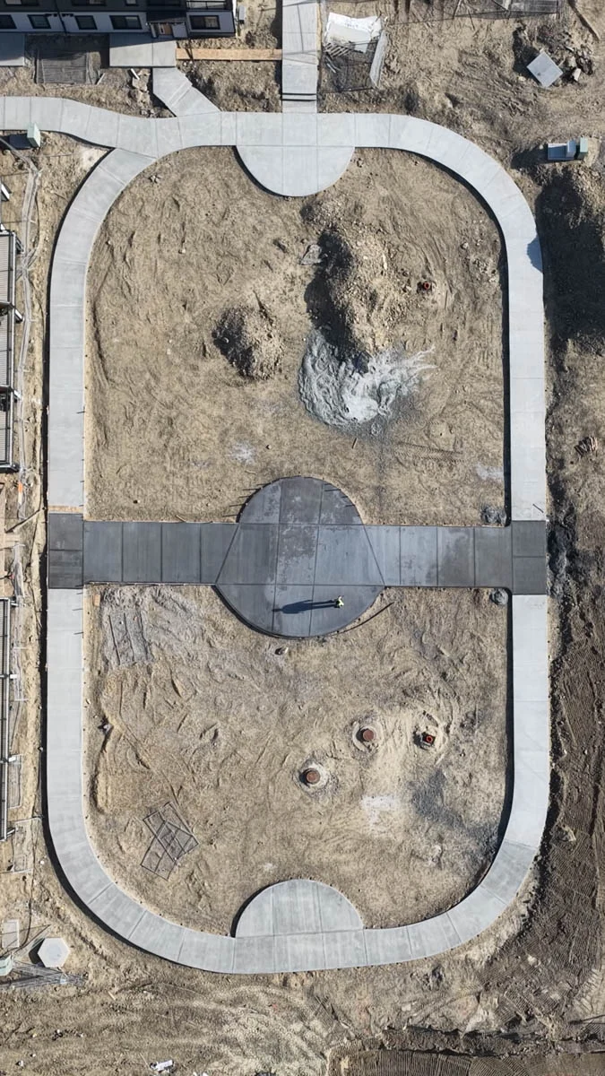 Pervious access road pour