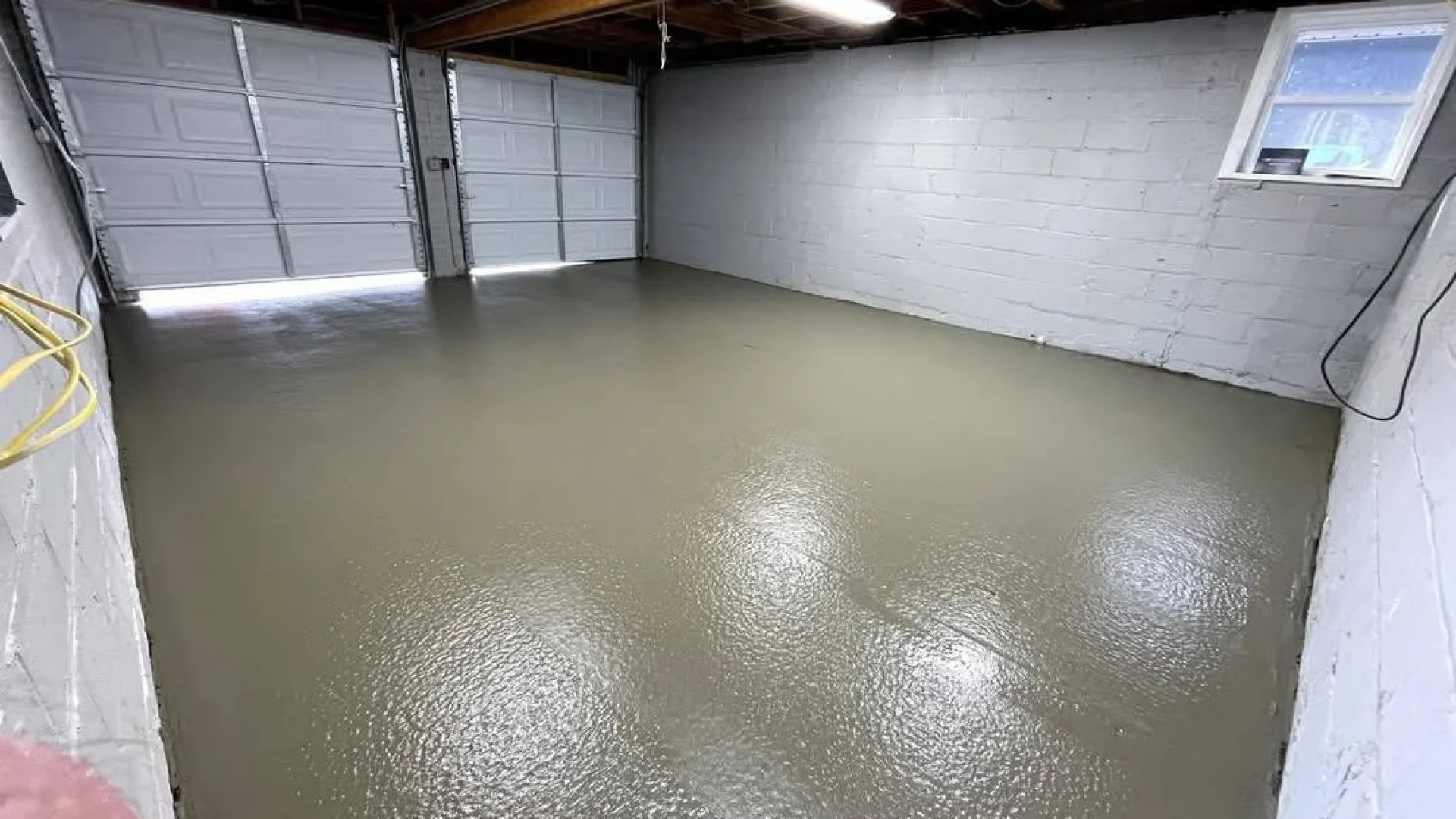 Garage floor concrete requirements in Calgary showing long-term wear from vehicle loads and freeze-thaw exposure